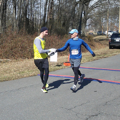 David Pittman receives the relay "baton" from Bill Hamblet.