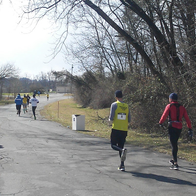 David Pittman, a composition in yellow and black, takes off on the 3rd leg of the relay.